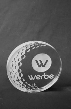 Round crystal award with a golf-ball dimple pattern and engraved Werbe logo